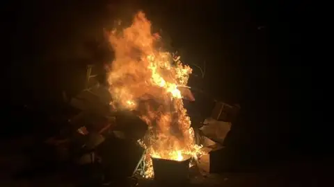 Flames reaching for the night.